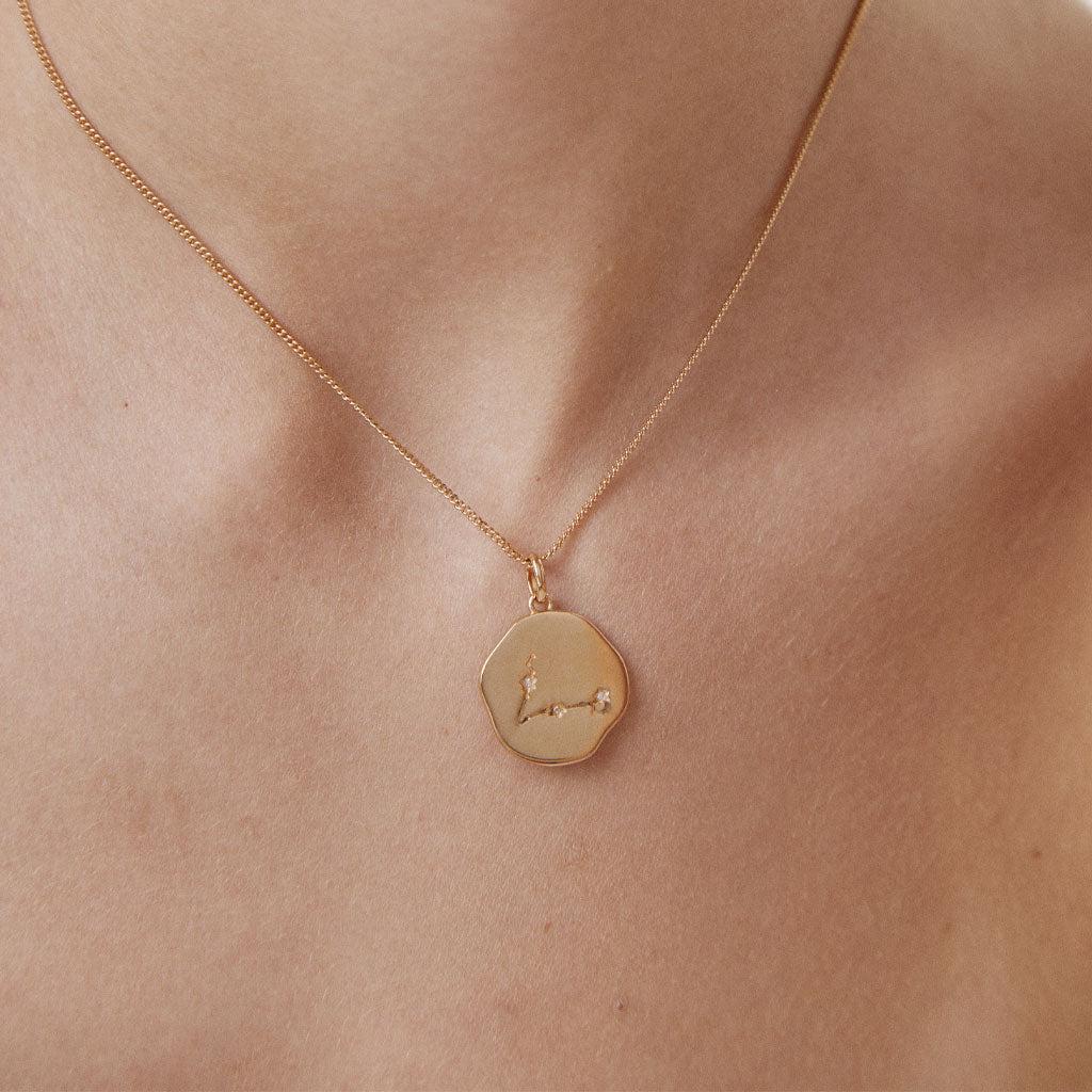 Gold plated PISCES constellation medal